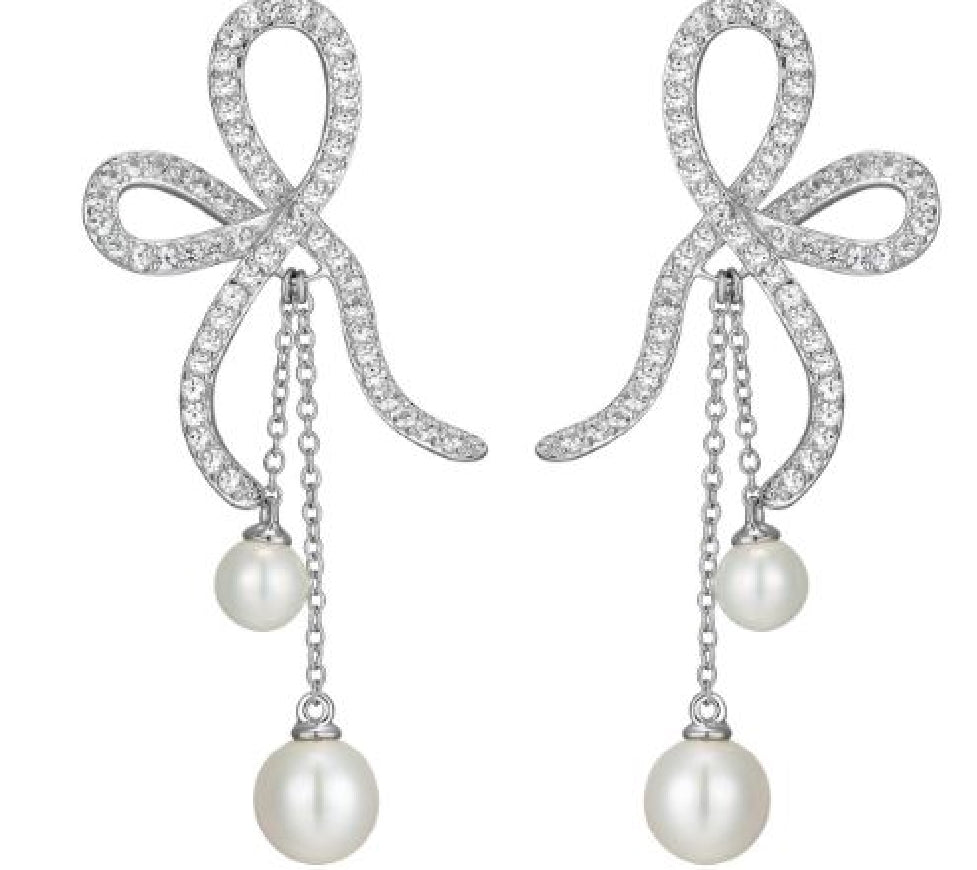 Sterling silver REIGN pearl bow earrings set with cubic zirconias