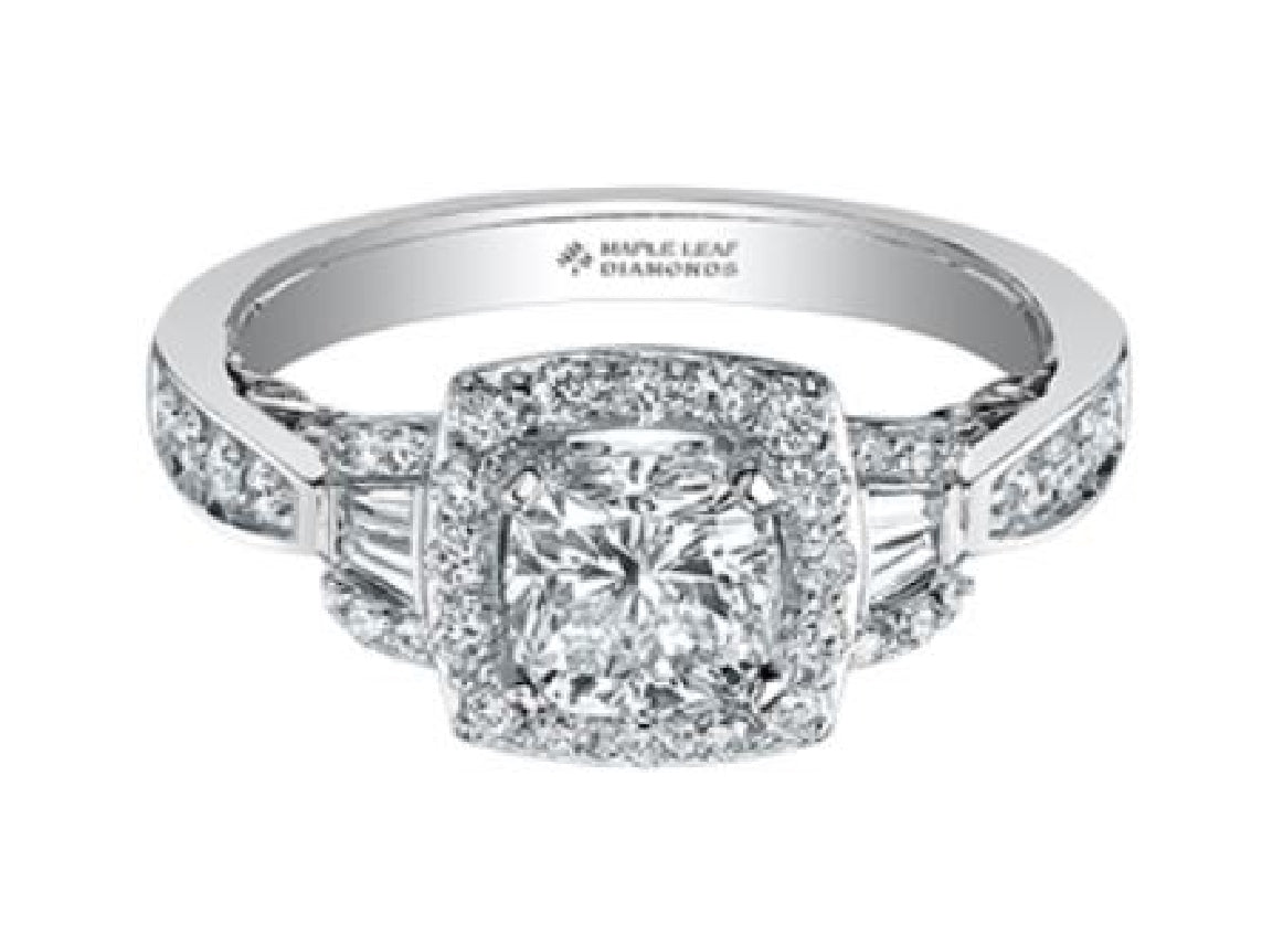 Lady's 18kt white gold MAPLE LEAF DIAMONDS engagement ring set with 1 x 0.56ct cushion cut CANADIAN diamond, 52 rbc diamonds = 0.36ct and 4 tapered baguette diamonds = 0.05ct
Total diamond weight = 0.97ct